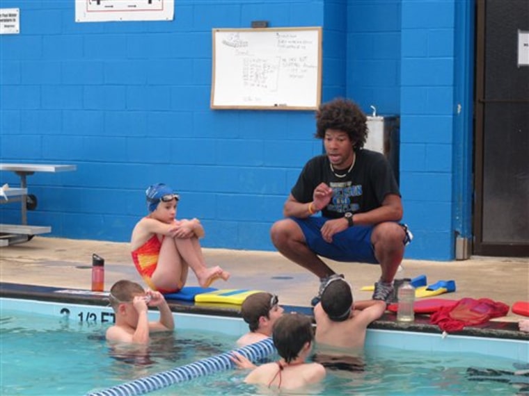Swim team instructor Tariq Turner gives instructions to members of the Anderson Swim Team at the Sheppard Swim Center, in Anderson, S.C., on May 11. The swim team is running the pool after city officials closed it to the public because of budget woes. 